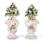 A pair of Derby vases, late 18th century, of rococo form, encrusted with flowers,