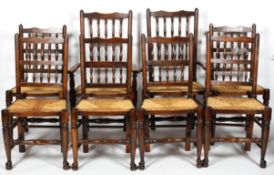 A set of eight ladderback dining chairs, with spindle back, rush seat and turned box stretcher,