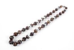 A single strand of graduated banded agate beads.