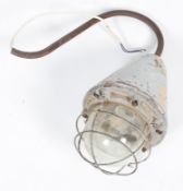 A Hayes & Co 'The Wigan' lamp, with cage surround to the large bulb,