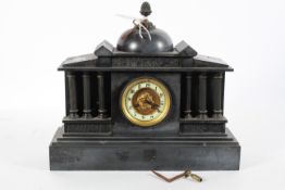 A Victorian slate mantel clock, of architectural form, with metal pine cone finial atop a dome,