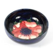A Moorcroft pin dish, in the anemone pattern, impressed signature and factory marks,