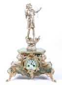 A Continental mantel clock, the 3" ivorine dial on a brass, eight day movement striking to a bell,