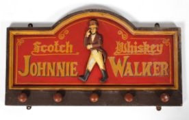 A Johnnie Walker Scotch Whiskey wooden advertising board,