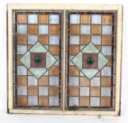 Two Late Victorian/Edwardian framed stained glass panels in rectangular wooden frame, in green,