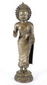 An eastern Buddha, Chinese or Tibetan, with silvered and bronzed finish,