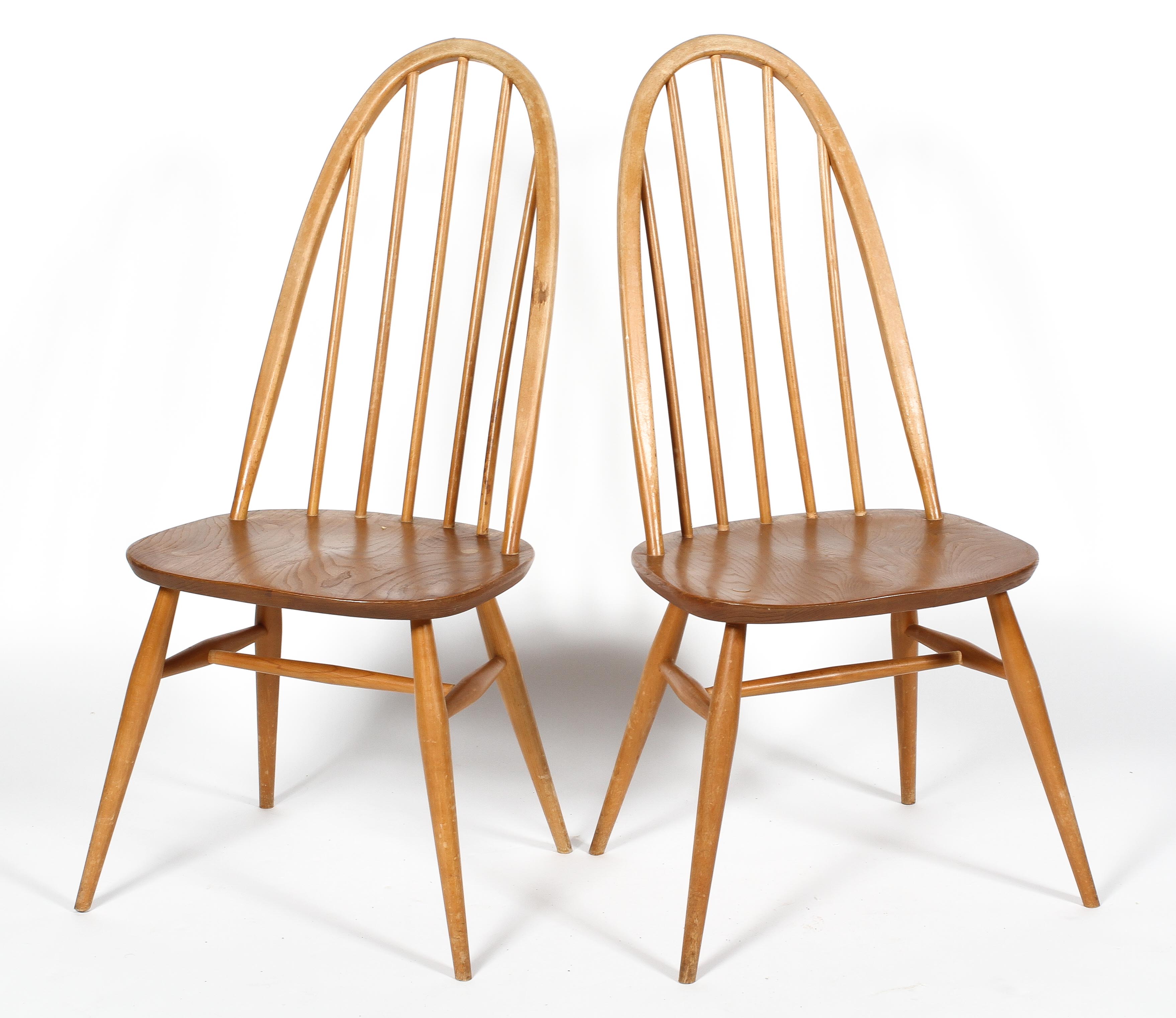 A pair of Ercol elm hoop back dining chairs,