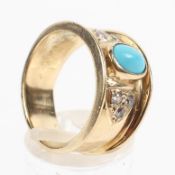 A yellow metal dress ring principally set with an oval cabochon