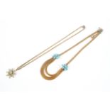 A gilt metal, turquoise and pearl star shaped pendant