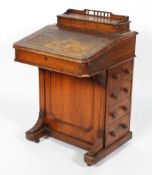A Victorian oak Davenport, inset with tooled leather top, with hinged stationary box to top,