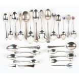 A collection of silver spoons and similar silver items, including examples with enamel finials,