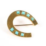 A yellow metal and turquoise mounted horseshoe brooch, height 2.7cm, gross weight 6.