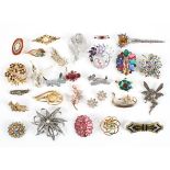 A collection of twenty eight costume brooches of variable designs.