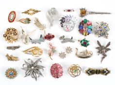 A collection of twenty eight costume brooches of variable designs.