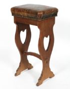 An Arts and Crafts style stool, with brass studded green leather seat,