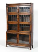 A Globe Wernicke style oak four tier bookcase, with leaded glass doors,