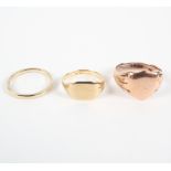 Three 9ct gold rings, comprising two signet and one wedding band, all marked .