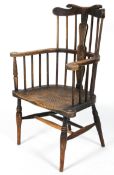 A Folk Art country armchair, the comb back with carved decoration, scrolled arms,