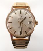 A gold plated Omega automatic watch. Circular silver dial with baton markings and date feature.