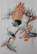 An Eastern silk work picture of peacocks in pine branches,