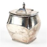 An unusual Edwardian silver tea caddy, the lid opening to reveal a gilt interior,