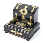 A Victorian brass-mounted ebonised stationary box with integral inkstand,