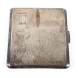 A mid century engine turned silver cigarette case of square form, gilt interior,