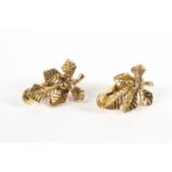 A yellow metal pair of clip on earrings of floral design. Hallmarked 9ct gold, Birmingham, 1936.