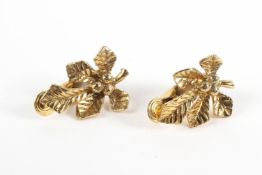 A yellow metal pair of clip on earrings of floral design. Hallmarked 9ct gold, Birmingham, 1936.