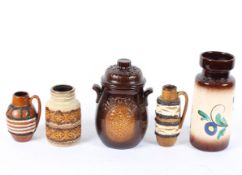 Five West German pottery vases, in tones of brown, with various floral and geometric designs,