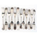 A late Victorian set of six fiddle pattern silver dinner forks,