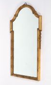 A Georgian style gilt wall mirror, with an arched top, inside a reeded frame,