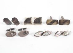 A collection of five pairs of cufflinks of variable designs. Gross weight: 52.4 grams