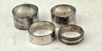 A group of four silver napkin rings, the largest hallmarked Sheffield 1926 by Atkin brothers,