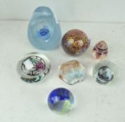 A collection of assorted glass paperweights, to include numerous by Caithness; Bullseye blue,
