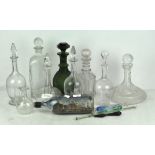 A large quantity of glass decanters,