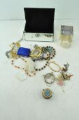 Three boxes of assorted vintage costume jewellery