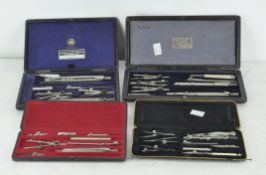 A collection of drawing instruments contained in four leather bound fitted boxes