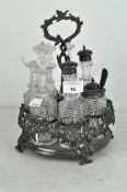 A slate 19th century silver plated cruet set of circular form by Elkington & Co,