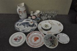 A collection of glassware and ceramics, including platters,