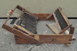 A wooden mounted table top weaving loom,