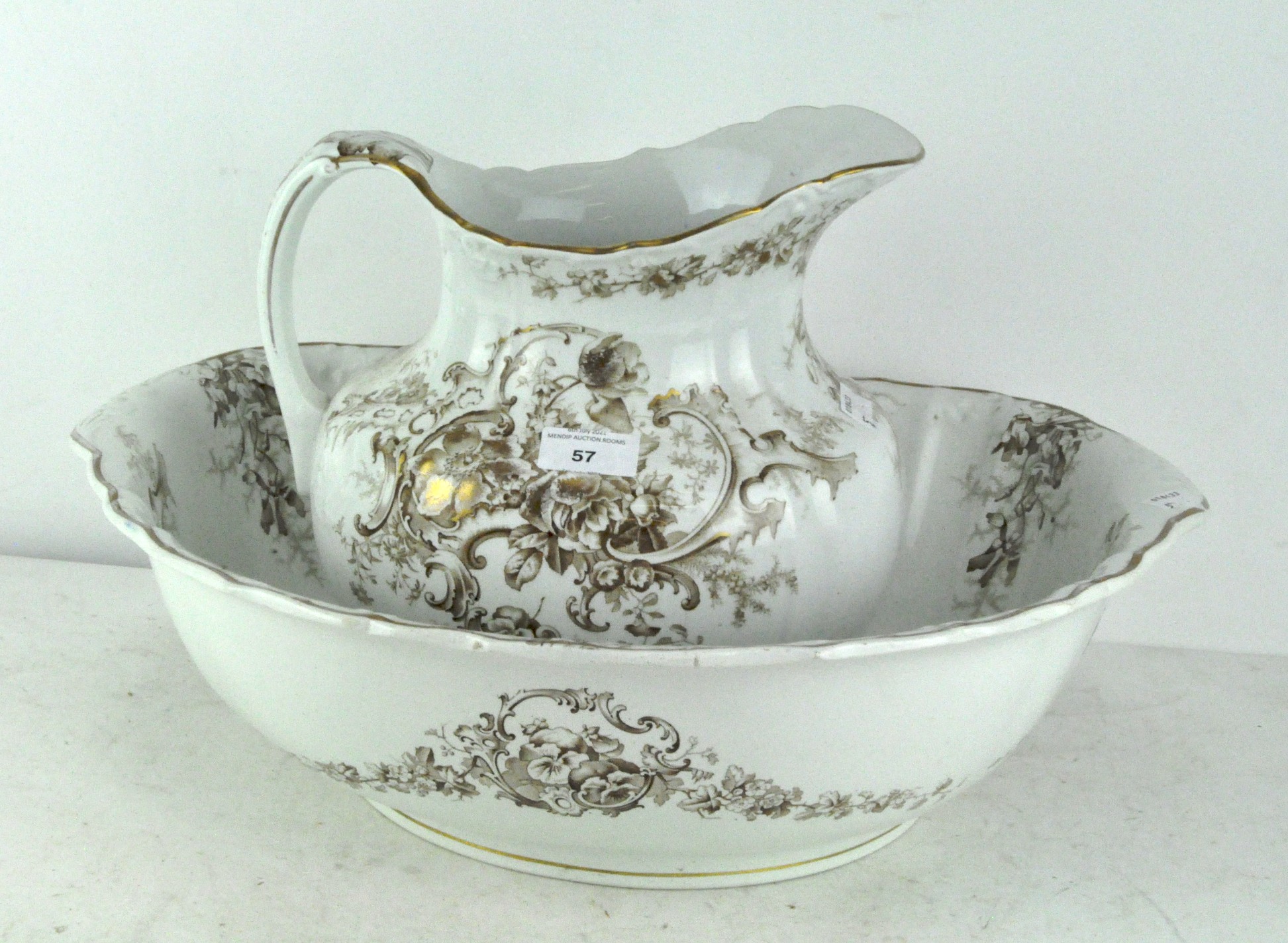 A late 19th century demi-lune wash bowl and jug set, white with gold decoration,