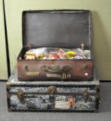 A wooden trunk filled with assorted board games,