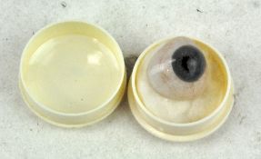 An early 20th century glass eye,