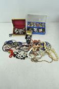 An assortment of vintage costume jewellery, necklaces,