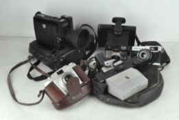 A selection of vintage cameras, to include Canon 514 XL-S,