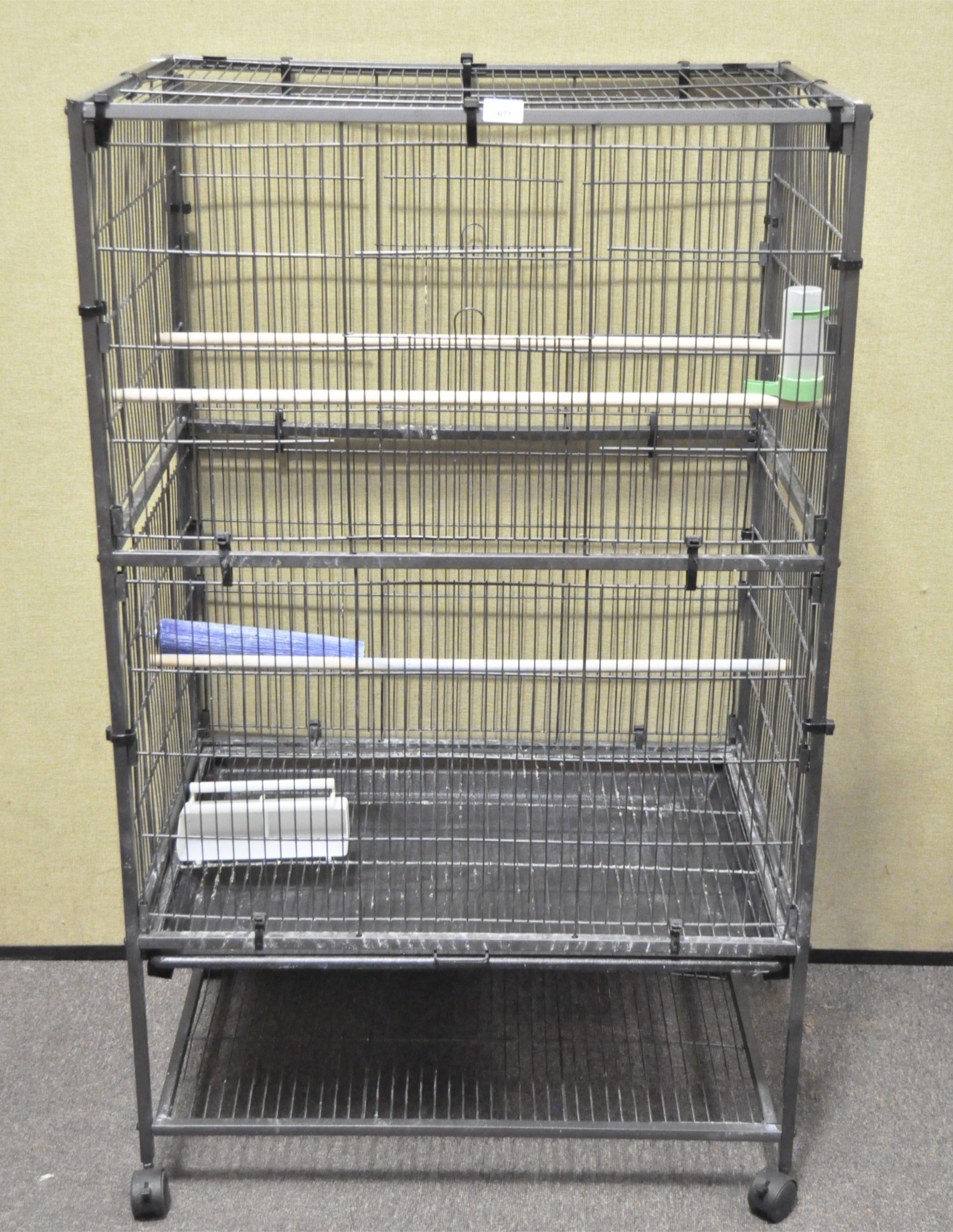 A large modern parrot/bird cage on casters,