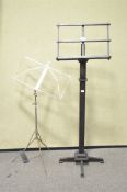 A wooden music stand on a square support,