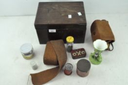 A mahogany box containing a selection of assorted collectables,
