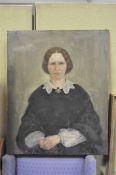 A late 19th century oil on canvas depicting a lady with sombre expression,